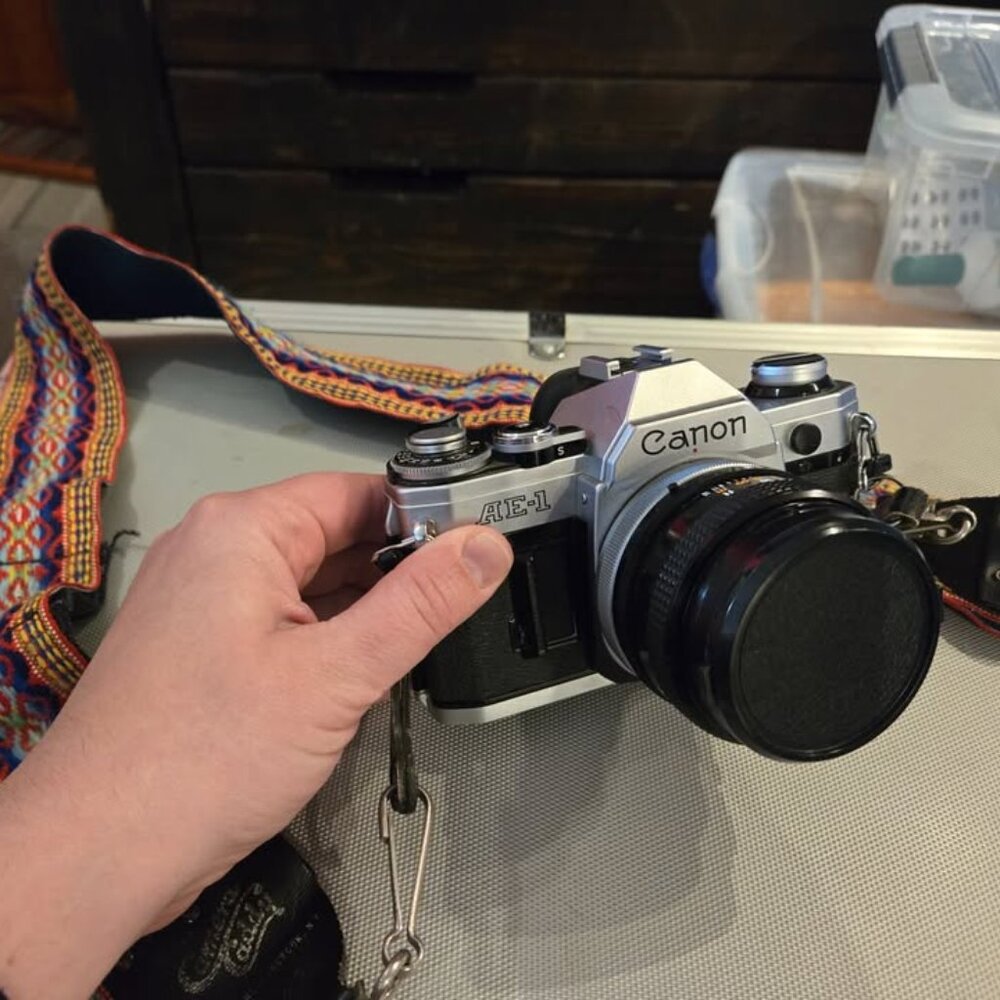 Canon AE-1 black and silver camera with original case and all accessories